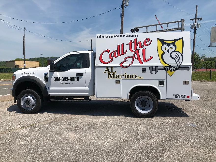 Photo of Al Marino Inc.'s service truck that has "call the al" decal on the side.