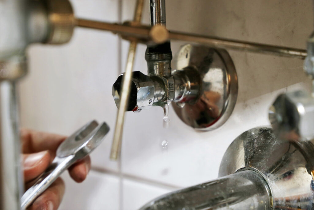 Plumber repairing a sink
